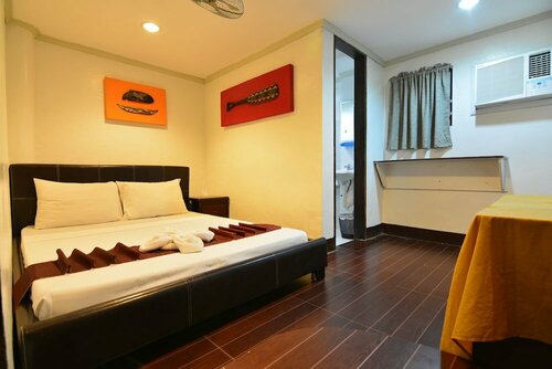 Kawayanan Heights Inn, Забронировать Отель Coron Town Proper 