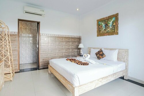 Agung Homestay Canggu Mitra RedDoorz, Забронировать Отель Недорогие отели провинции Бали, недорого