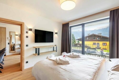 Emma Deluxe Aparthotel, Aircondition, ganzjährig beheizter Außenpool & Skibus direkt vor der Tür, Забронировать Апартаменты/квартира Пизендорф Europa Sportregion
