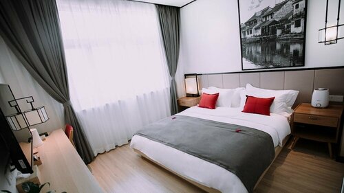 Floral Hotel Wuzhen Linshuige, Забронировать Отель Учжэнь Цзясин