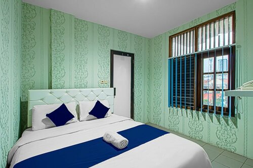 Wisma Bungur Syariah by OYO Rooms, Book Hotel Hoteller i Jakarta med parkering, Parkering