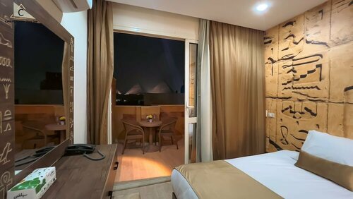 Celia Pyramids View inn, Забронировать Отель «постель и завтрак» Недорогие отели Гиза, недорогие