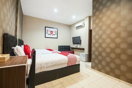 Coin Mulia Hotel By OYO Rooms, Забронировать Отель Отели провинции Северной Суматры с парковкой, Парковка