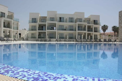 Amphora Hotel & Suites, Забронировать Отель Пафос Пафос, рядом с Пляж Врисудия ΙΙ