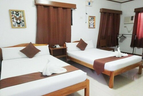 Tenzai Homestay, Забронировать Гостевой дом Отели в центре Пуэрто-Принсеса, в центре