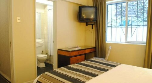 Apart Hotel Carlton House, Забронировать Апарт-отель Сантьяго Столичный регион Сантьяго, рядом с Муниципальный театр Сантьяго