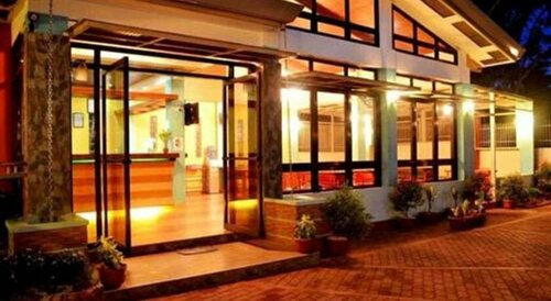 Julieta's Pension House, Забронировать Отель «постель и завтрак» Bancaobancao Пуэрто-Принсеса