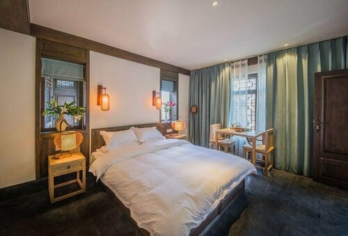 Lijiang Zhuyun boutique Hotel, Забронировать Бутик-отель Лицзян Юньнань, рядом с Улица Сквер-стрит Древнего города Даянь