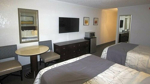 At Home Inn & Suites, Book Hotel Brent USA
