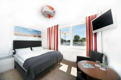Hotel Meerzeit, Забронировать Отель Шарбойц Holstein Switzerland