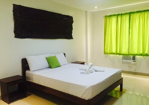 Orchid Lagan Place Palawan, Забронировать Отель Пуэрто-Принсеса Puerto Princesa City, рядом с Balinsasayaw Restaurant - Rizal