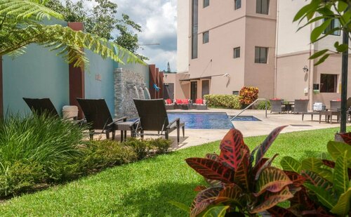 Courtyard by Marriott San Salvador, Забронировать Отель Сан-Сальвадор San Salvador Department