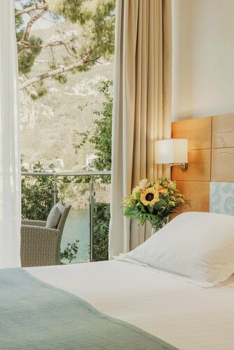 Akrotiri Beach Resort & Spa, Забронировать Курортный отель Отели Палеокастрица 5 звезд, 5*