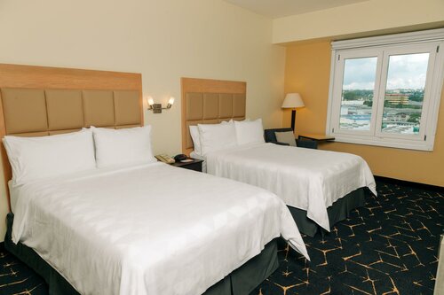 Holiday Inn San Salvador by IHG, Забронировать Отель Сан-Сальвадор San Salvador Department