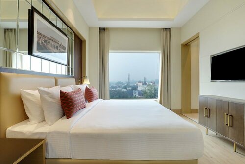 Lemon Tree Hotel Jhansi, 예약 호텔 Jhansi 주차 가능 호텔, 주차장