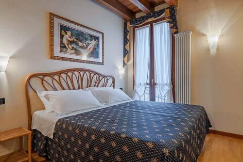 Palazzo Brando - Living Apartments, Забронировать Апартаменты/квартира Тревизо Венето, рядом с Центральный вокзал Тревизо