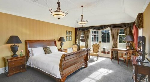Fletcher Lodge, Забронировать Отель Данидин Отаго, рядом с Toitu Otago Settlers Museum