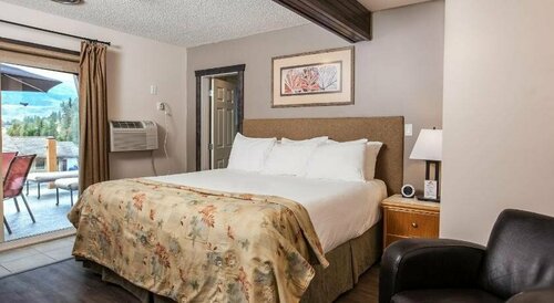 Swiss Chalet Motel, Забронировать Шале Ревелсток Ревелсток