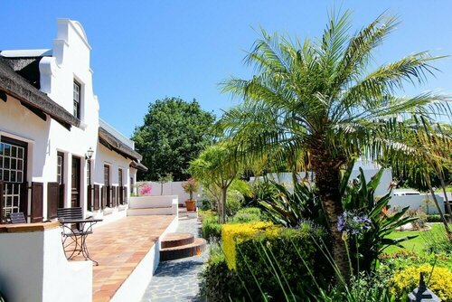Cape Village Lodge, Забронировать Гостевой дом Дурбанвиль Северный пригород Кейптауна