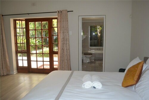 Cycad Lodge, Забронировать Гостевой дом Недорогие отели Ист-Лондона, недорогие