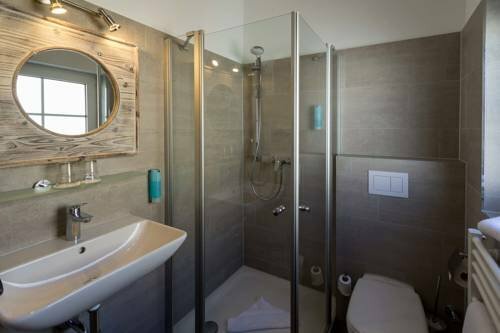 Hotel Strandschlösschen, Забронировать Отель Травемюнде земля Шлезвиг-Гольштейн