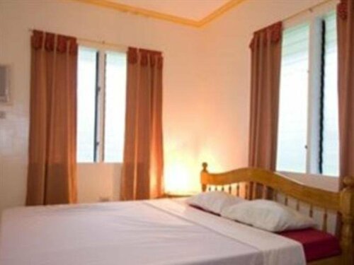 Whispering Palms Island Resort, Đặt Khu nghỉ dưỡng San Carlos Visayas