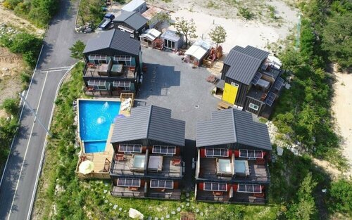 Pohang Songra Aqua Tourist Pension, Забронировать Отель Пхохан провинция Кёнсан-Пукто